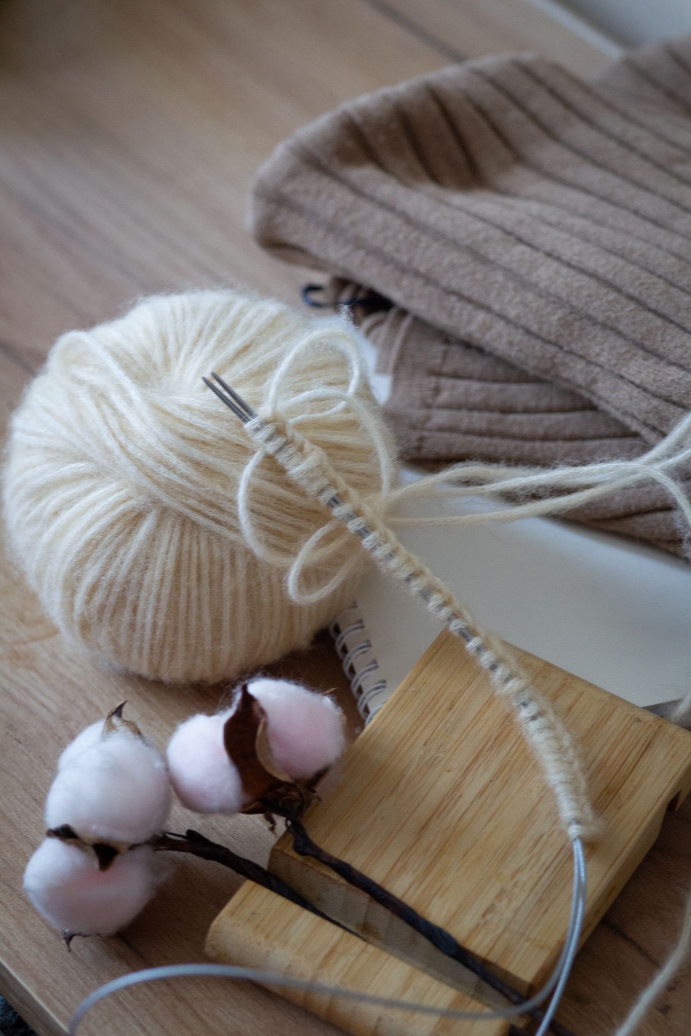Cotton and yarn used as an illustrative natural-fiber image